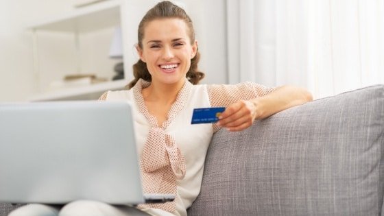 woman with credit card shopping online