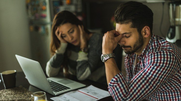 couple reviewing debt and bills