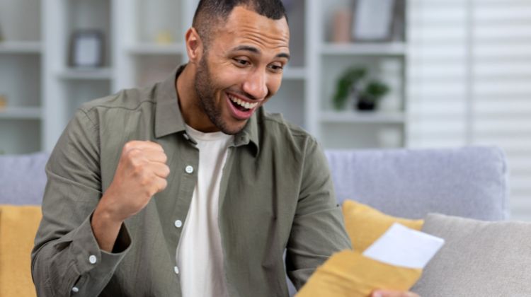 man opening envelope