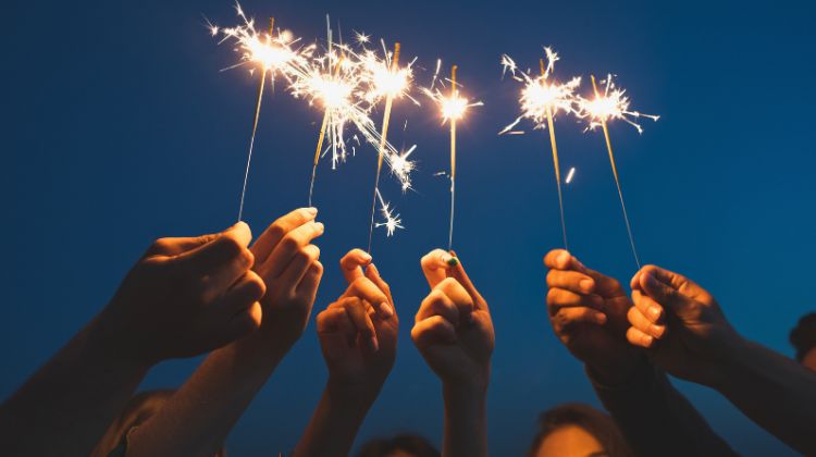 friends holding sparklers