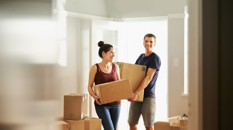 happy couple moving into their first home