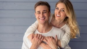 young couple posing for photo