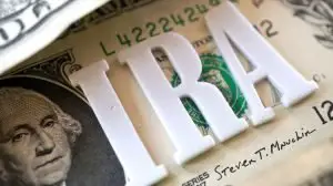 IRA letters on top of a dollar bill