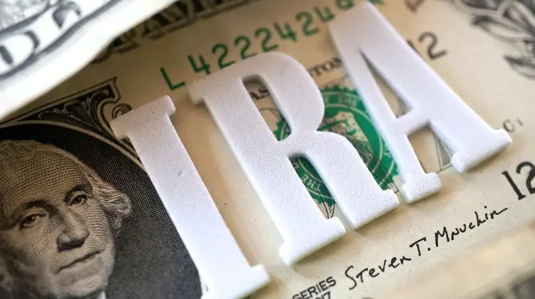 IRA letters on top of a dollar bill