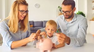 young family practicing savings habits