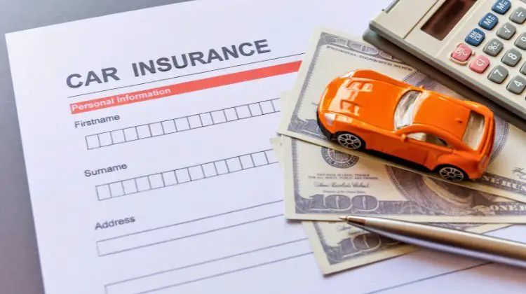 insurance application with a toy car and money on top