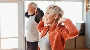 senior couple exercising inside