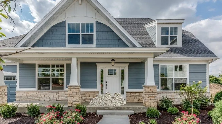 home with a visual of cash on the front porch to represent equity